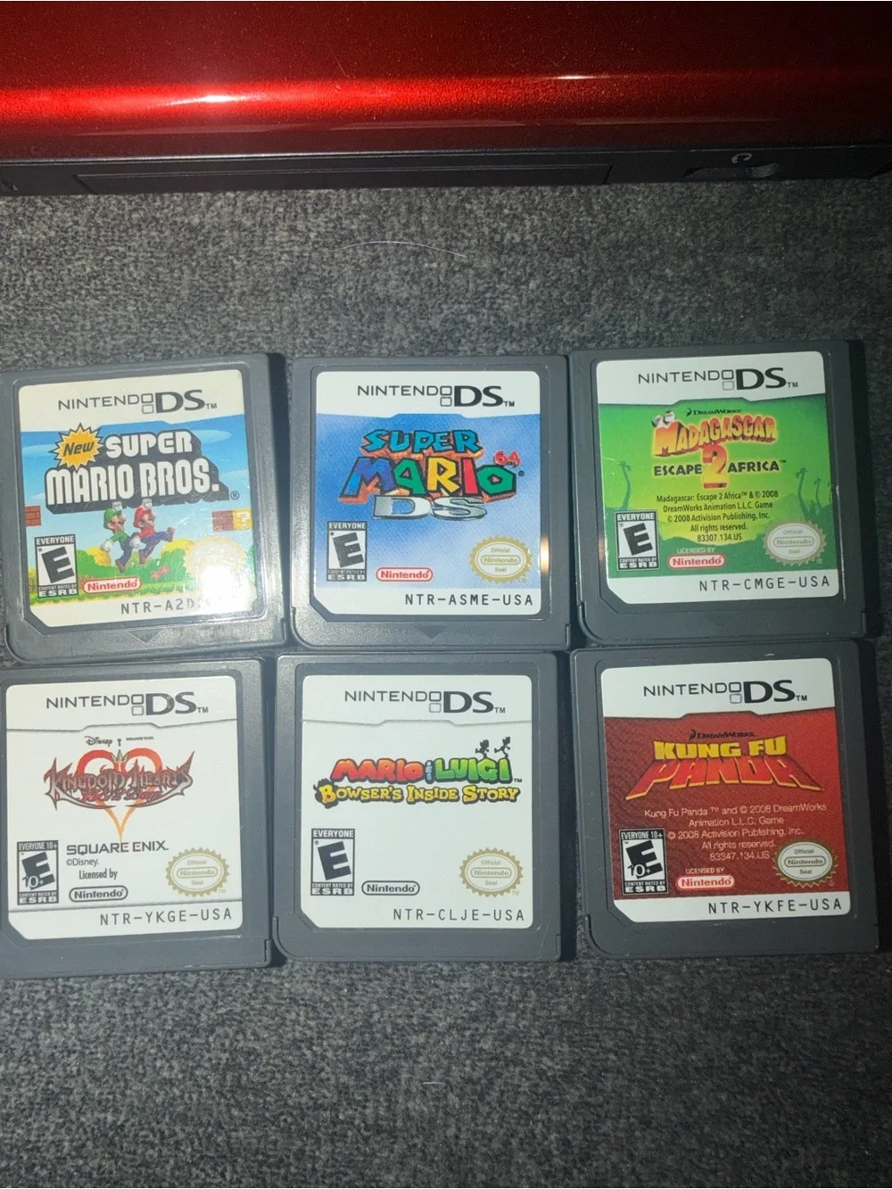 Nintendo DS Lite Crimson Red & Black Lot with 6 Games (Mario, Kingdom Hearts)